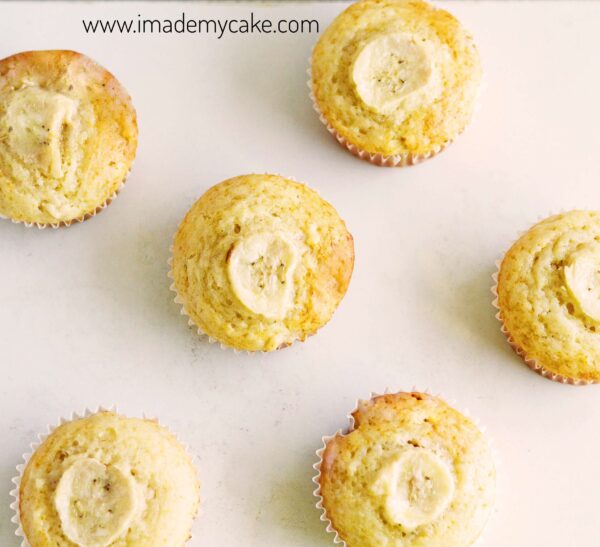 Banana muffins with sliced bananas on top