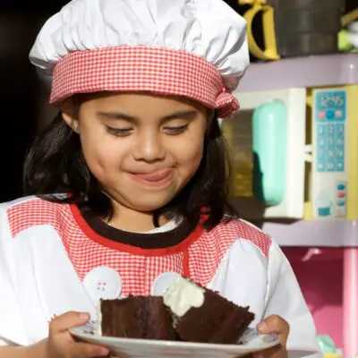 girl enjoying homemade cakes