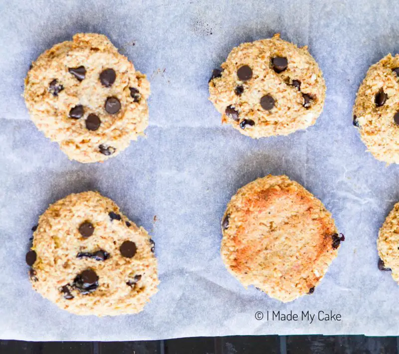 banana oatmeal cookies with one cookie flipped over to show baked color
