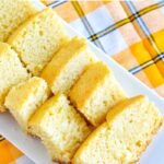 hot milk cake slices on a white rectangular plate