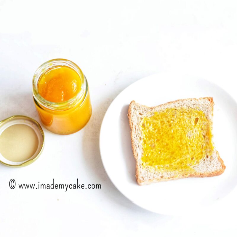 homemade mango jam on a slice of white bread