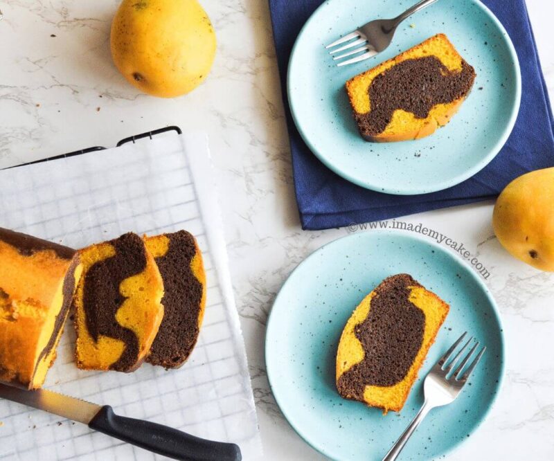 chocolate mango cake slices on blue plates