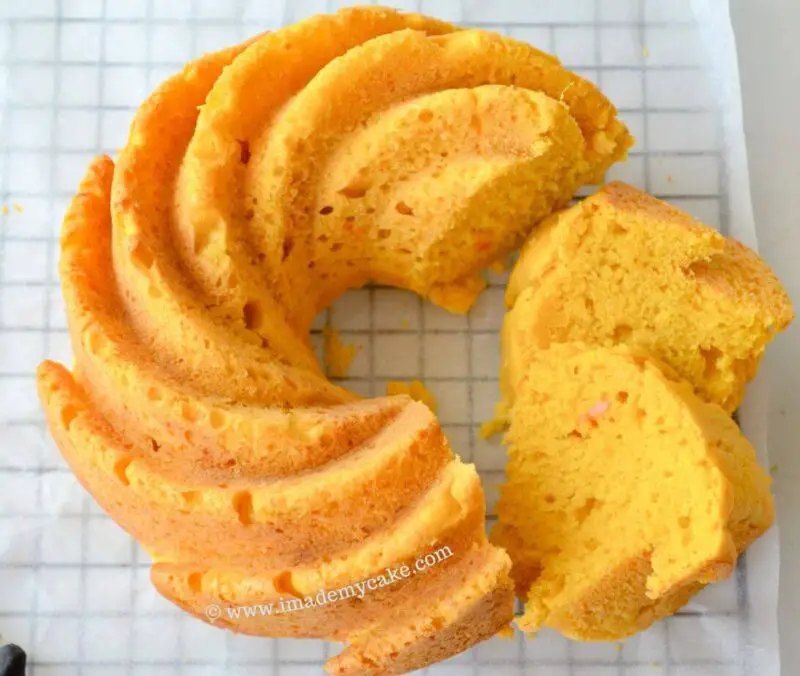 eggless mango bundt cake with two slices cut