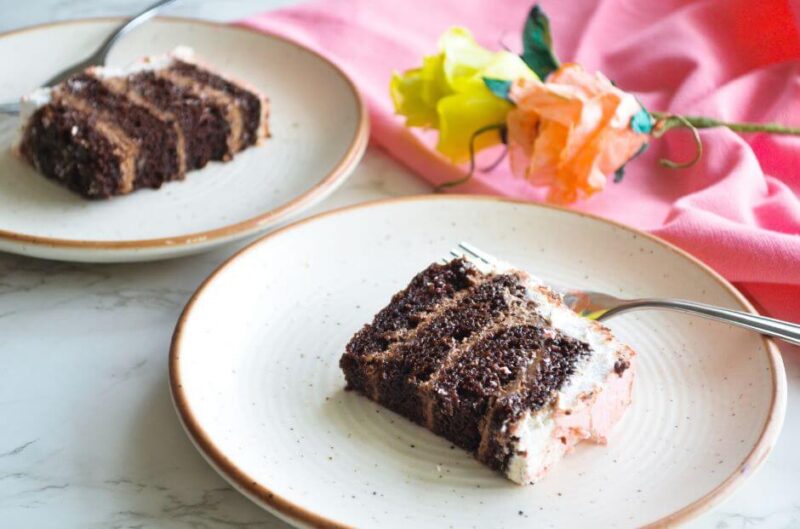 slices of chocolate buttermilk cake with handmade wafer paper flowers