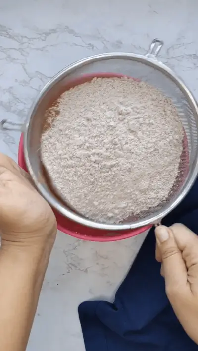 sift dry ingredients for making ragi cookies